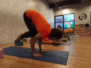 Community Fitness Student doing Crow