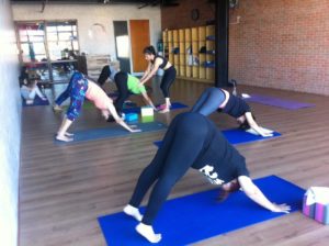 Students practicing Yoga at Community Fitness